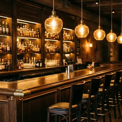 Warm bar interior lit by rows of pendant lamps